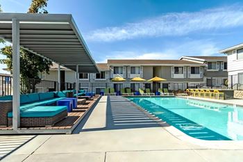 Two swimming pools with lounge seating